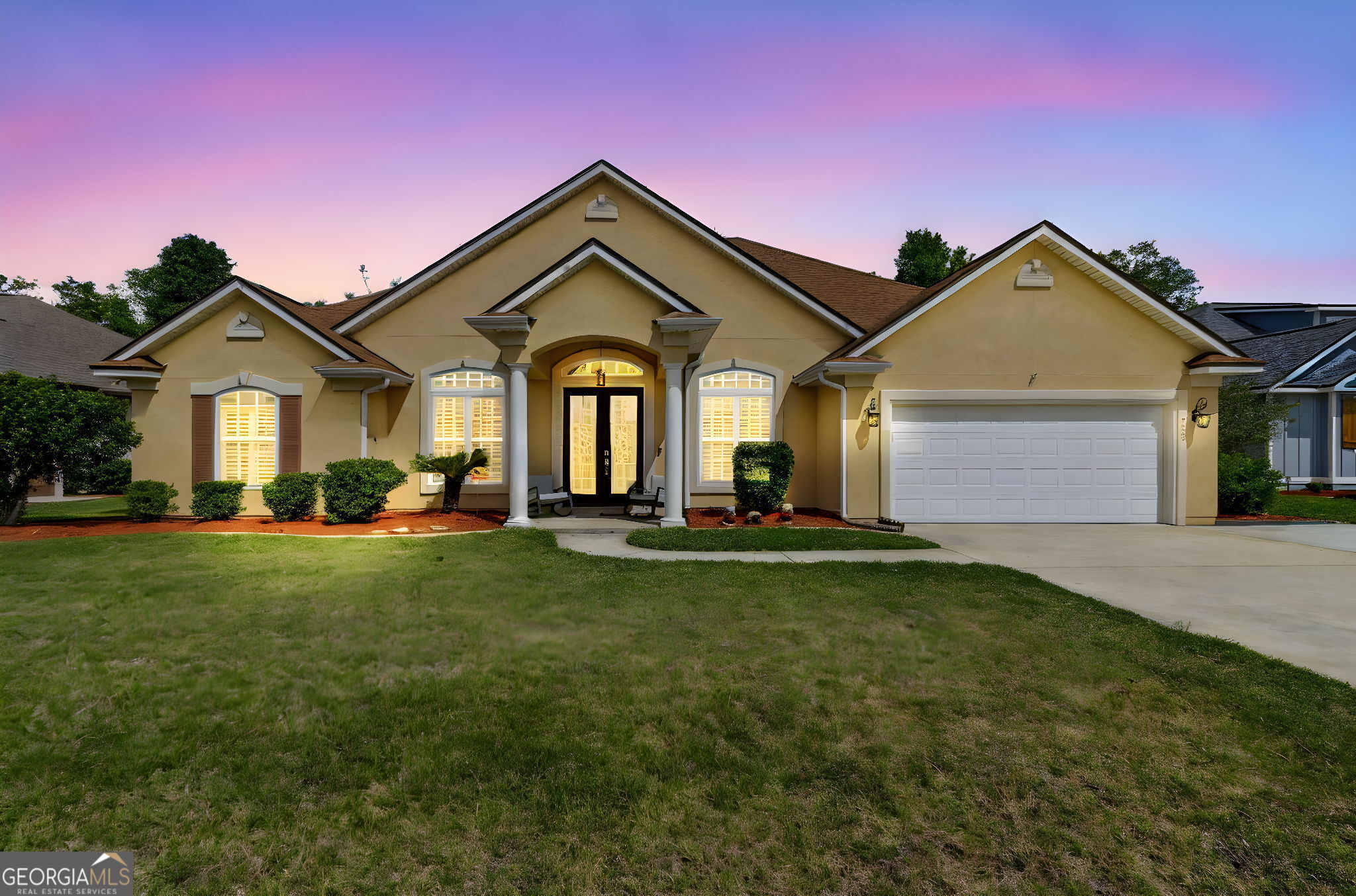 a front view of a house with a yard