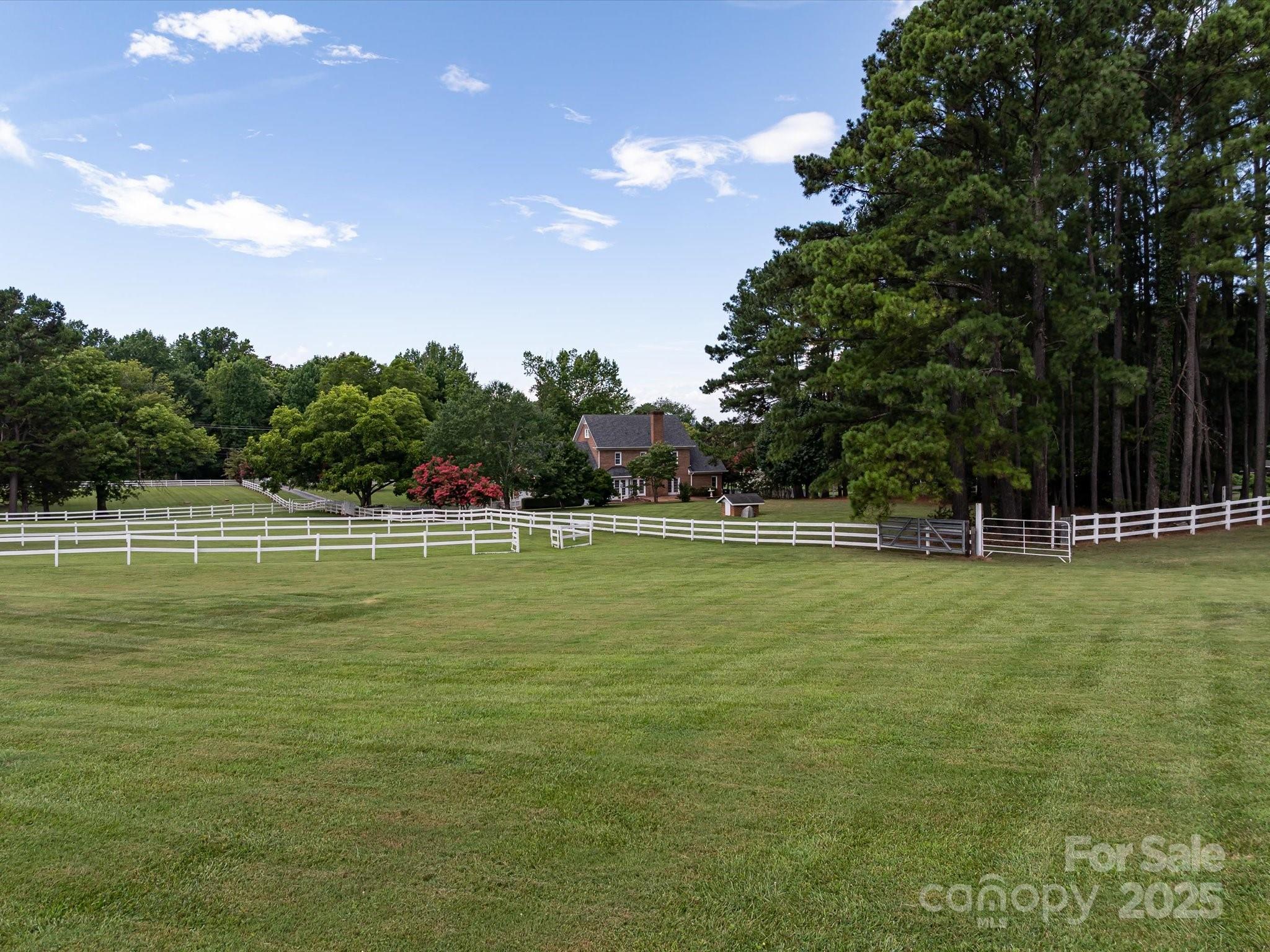 11215 Idlewild Road Matthews, NC 28105 - Photo 14 of 48 a swimming pool with outdoor seating and yard
