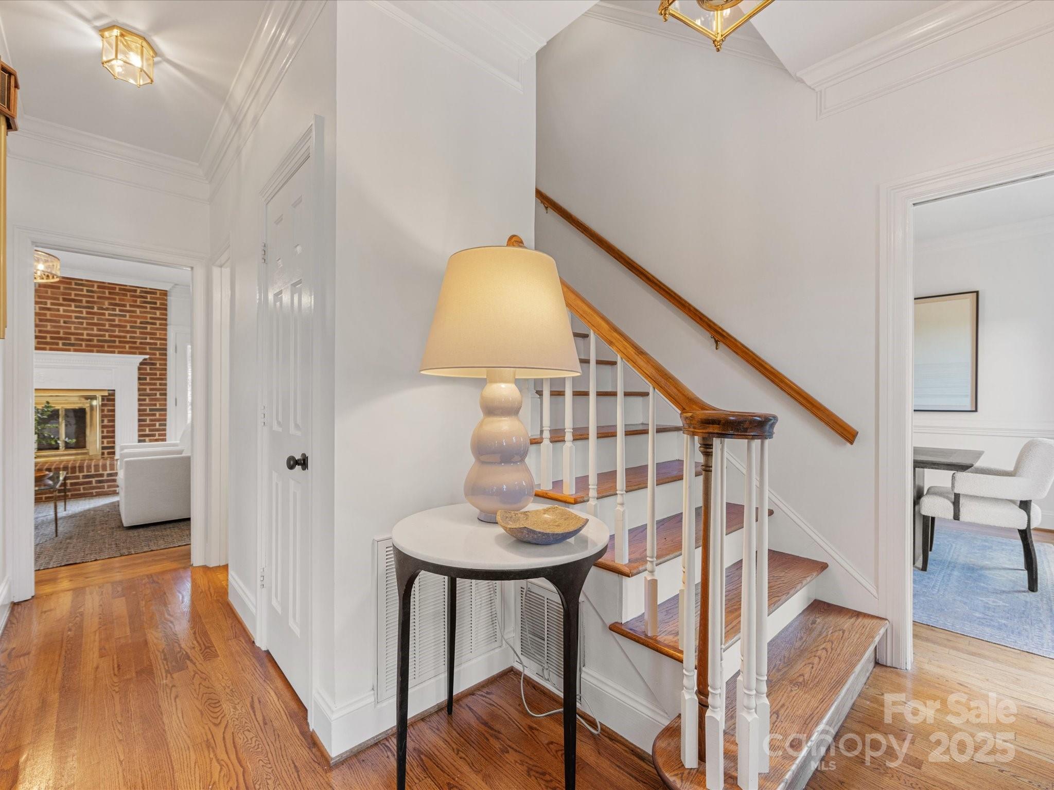 11215 Idlewild Road Matthews, NC 28105 - Photo 22 of 48 a view of entryway and hall with wooden floor