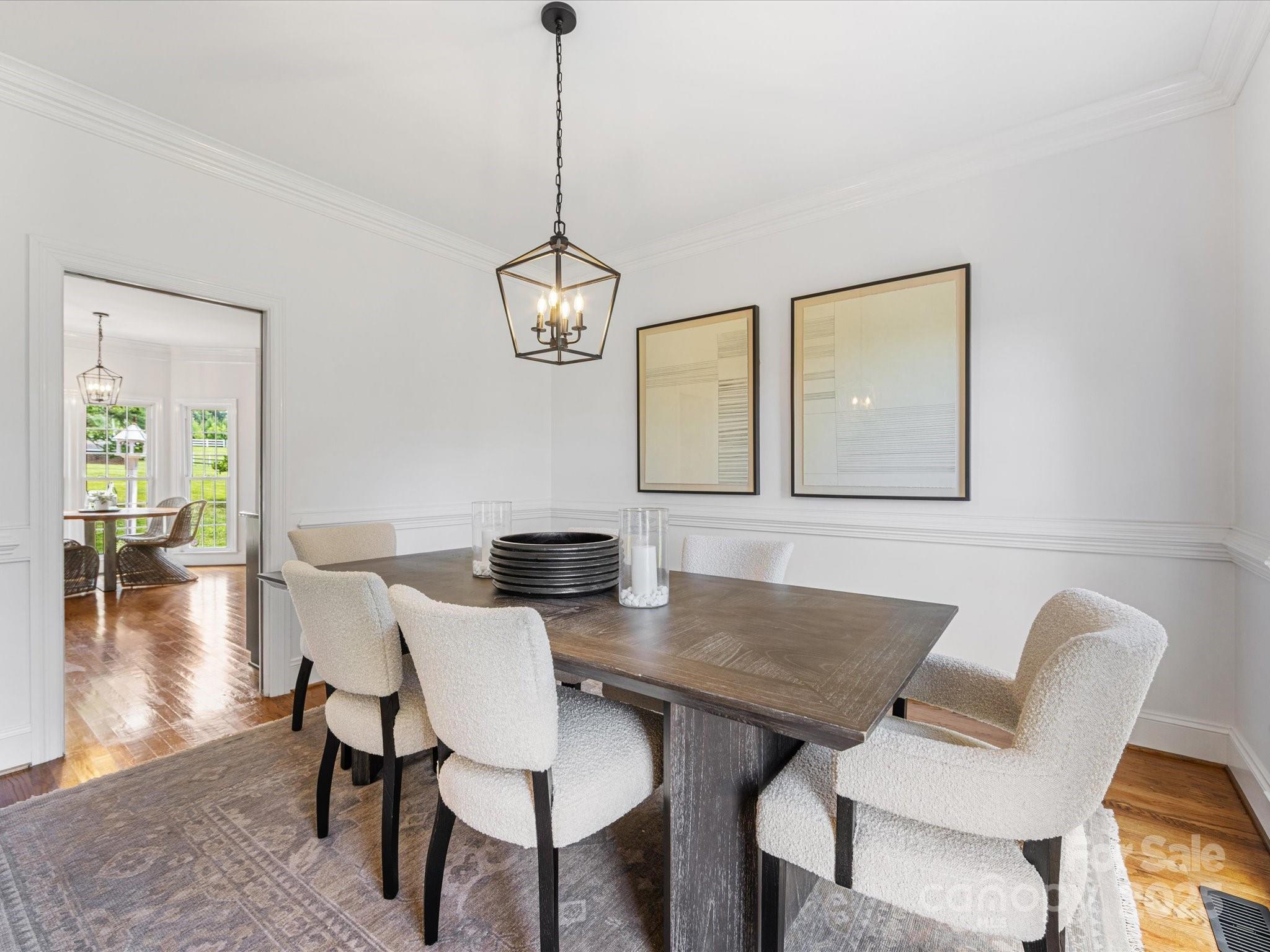 11215 Idlewild Road Matthews, NC 28105 - Photo 26 of 48 a view of a dining room with furniture and wooden floor