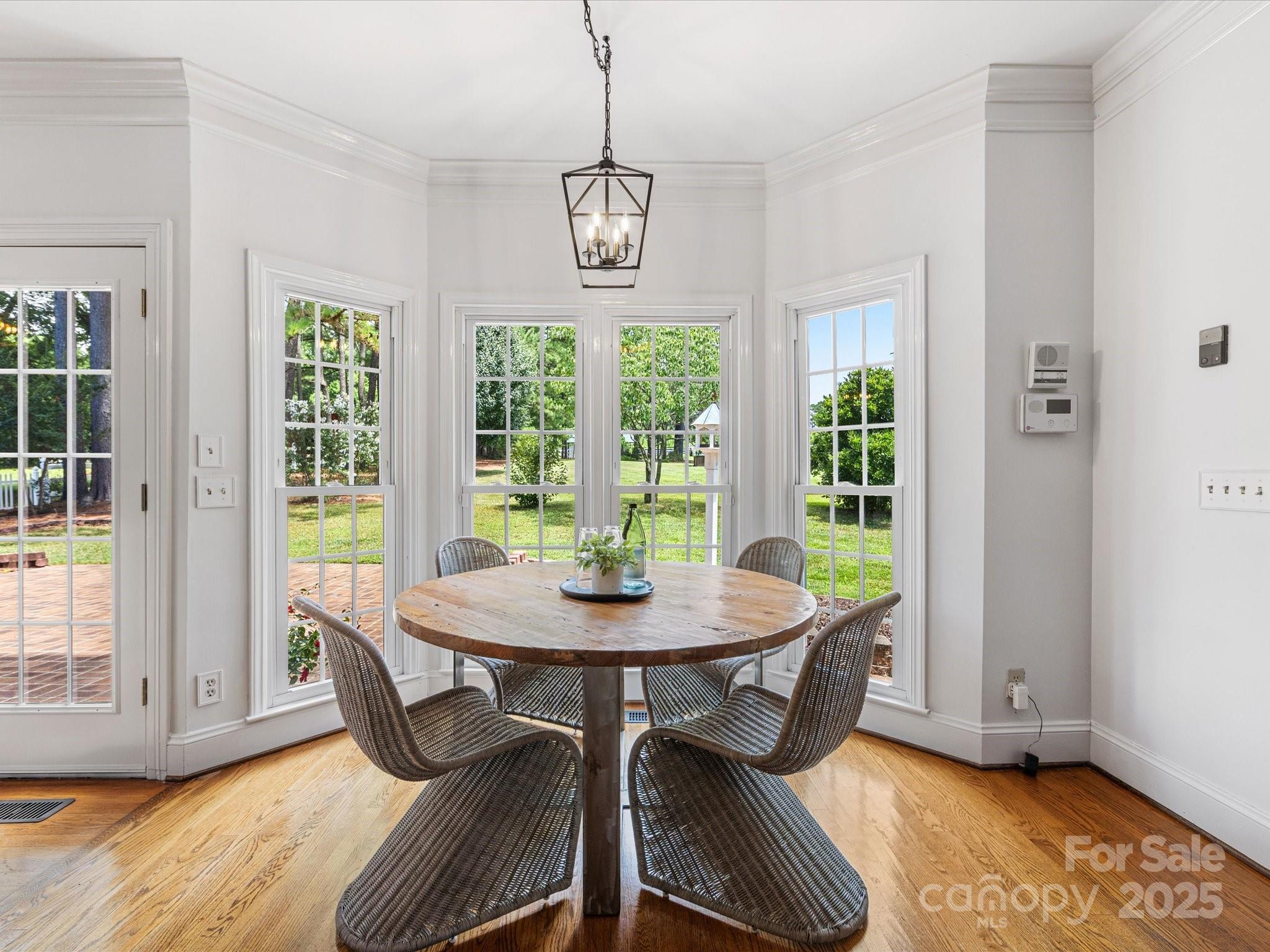 11215 Idlewild Road Matthews, NC 28105 - Photo 34 of 48 a view of a dining room with furniture window and outside view
