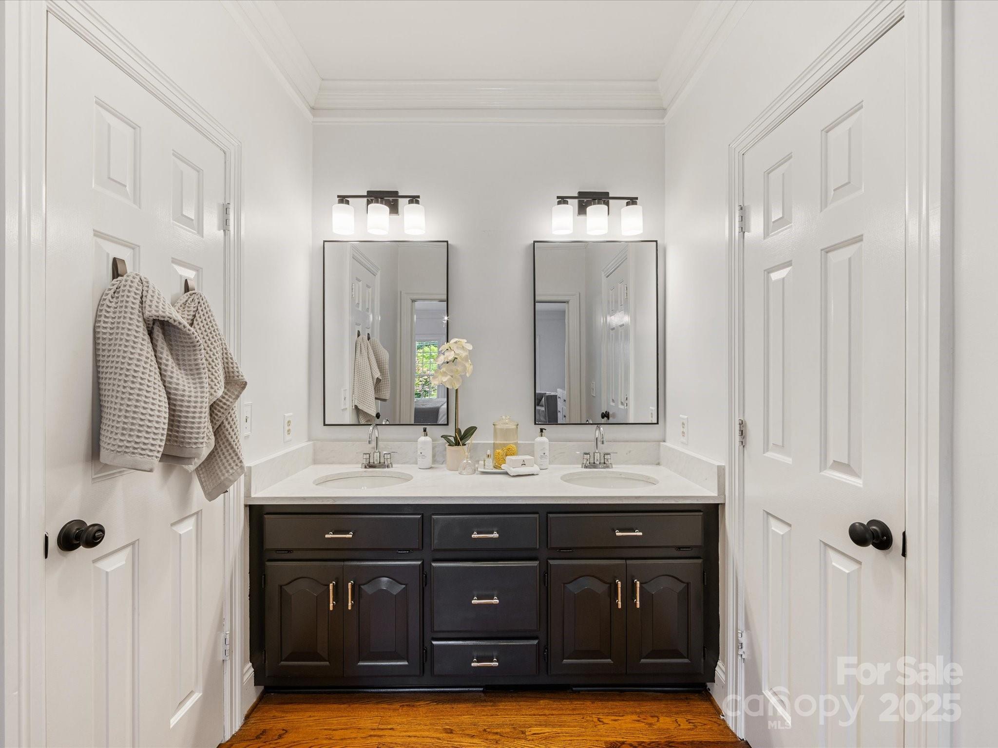 11215 Idlewild Road Matthews, NC 28105 - Photo 36 of 48 a bathroom with a granite countertop double vanity sink and mirror