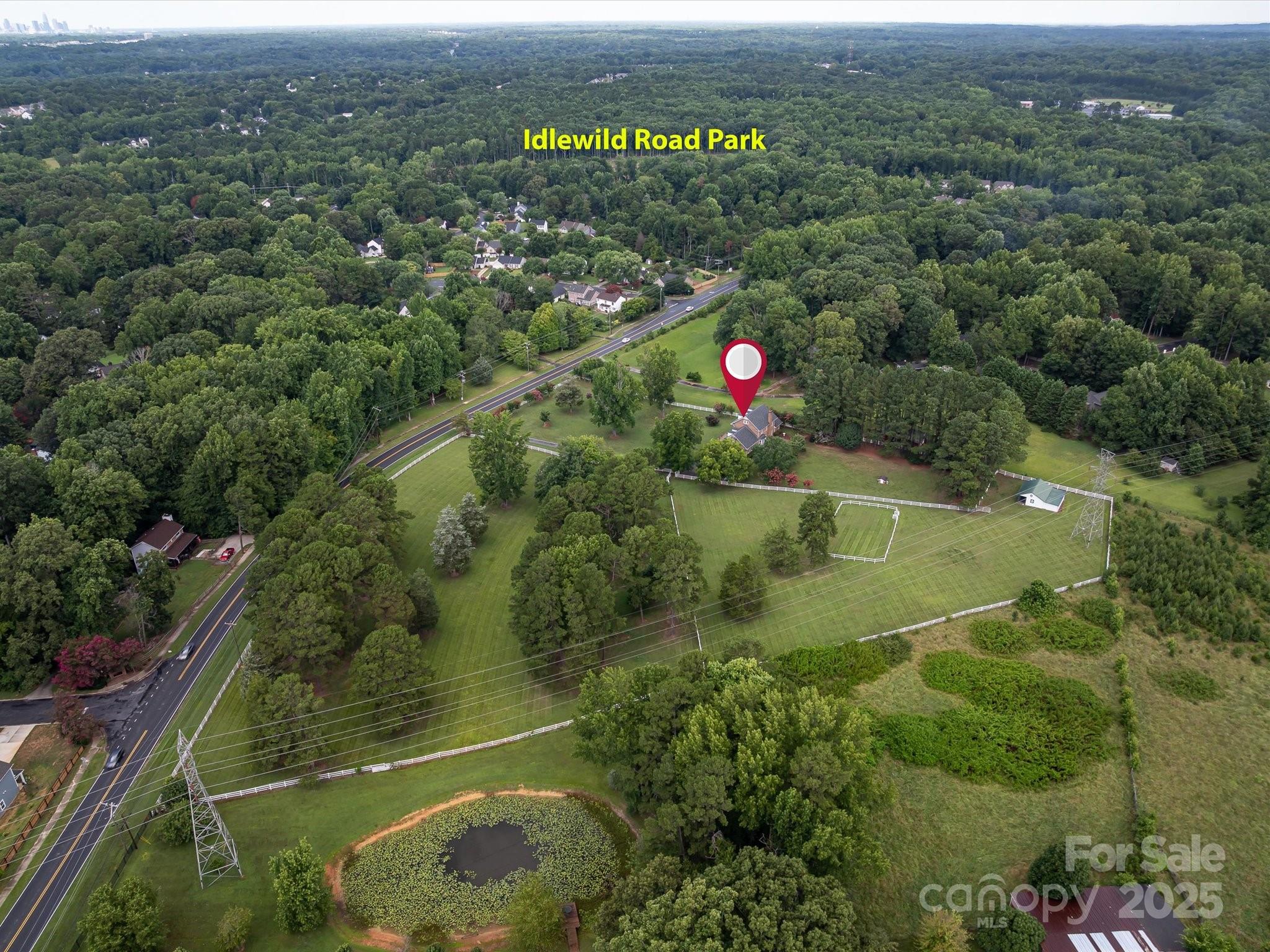 11215 Idlewild Road Matthews, NC 28105 - Photo 4 of 48 an aerial view of residential houses with outdoor space and swimming pool
