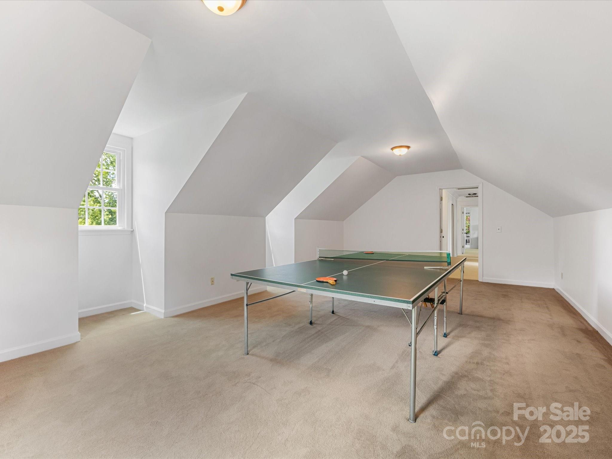 11215 Idlewild Road Matthews, NC 28105 - Photo 45 of 48 a room with gym equipment and windows