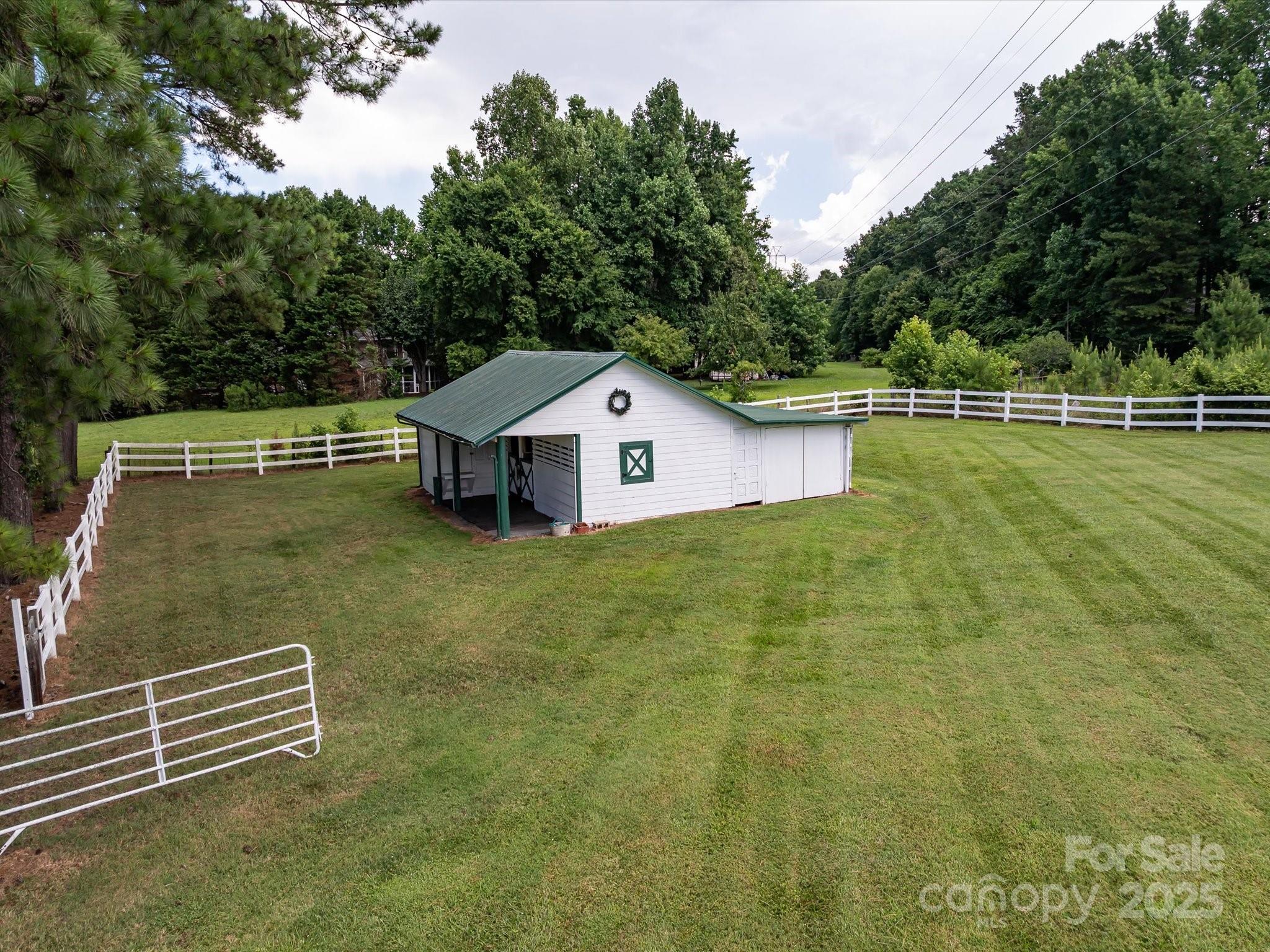 11215 Idlewild Road Matthews, NC 28105 - Photo 7 of 48 a house view with a outdoor space