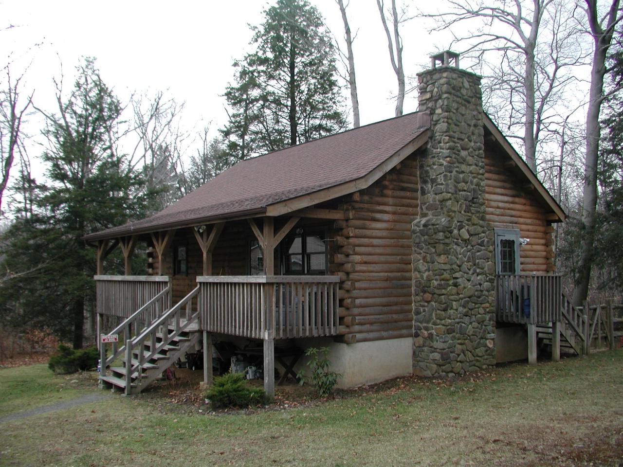 384 Green Road Tobyhanna, PA 18466 - Photo 1 of 6 a view of a wooden house with a yard