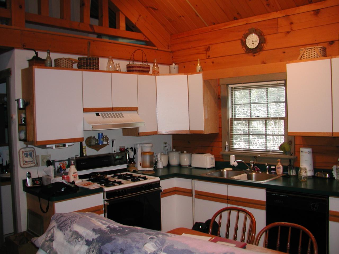 384 Green Road Tobyhanna, PA 18466 - Photo 4 of 6 a kitchen with a stove a microwave and cabinets