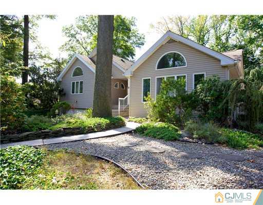 5 Beech Lane Edison, NJ 08820 - Photo 1 of 25 a front view of a house with garden