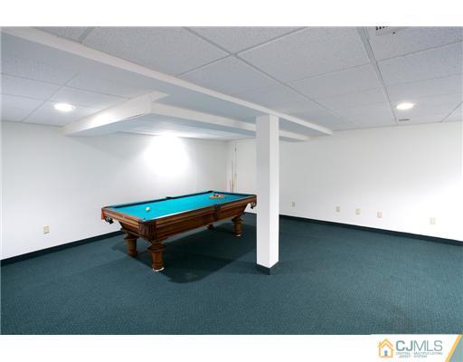 5 Beech Lane Edison, NJ 08820 - Photo 14 of 25 a room with pool table and windows