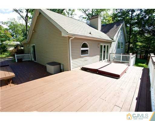 5 Beech Lane Edison, NJ 08820 - Photo 18 of 25 a view of a house with backyard and sitting area