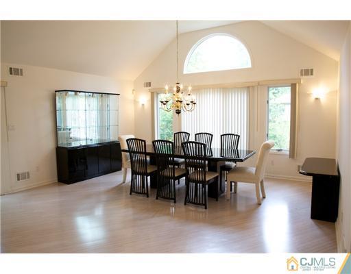 5 Beech Lane Edison, NJ 08820 - Photo 22 of 25 a view of a dining room with furniture and chandelier