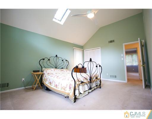 5 Beech Lane Edison, NJ 08820 - Photo 24 of 25 a bedroom with a bed and a window