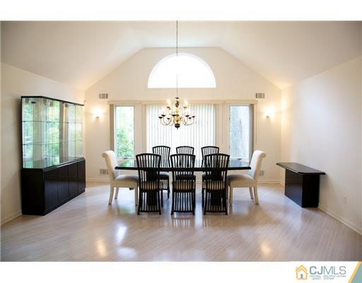 5 Beech Lane Edison, NJ 08820 - Photo 4 of 25 a view of a dining room with furniture and chandelier