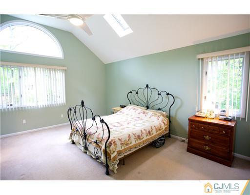 5 Beech Lane Edison, NJ 08820 - Photo 9 of 25 a bedroom with a bed and window