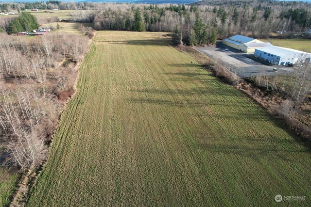 a view of a swimming pool with a yard