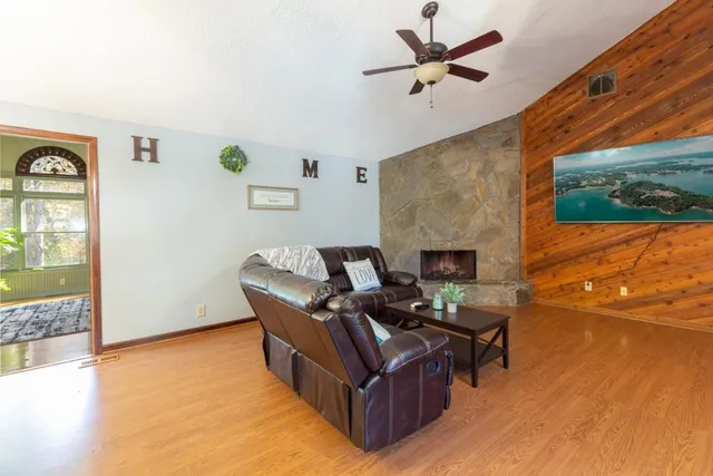 a living room with furniture and a fireplace
