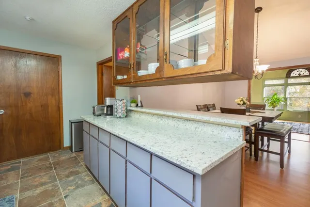 a kitchen with a sink and cabinets