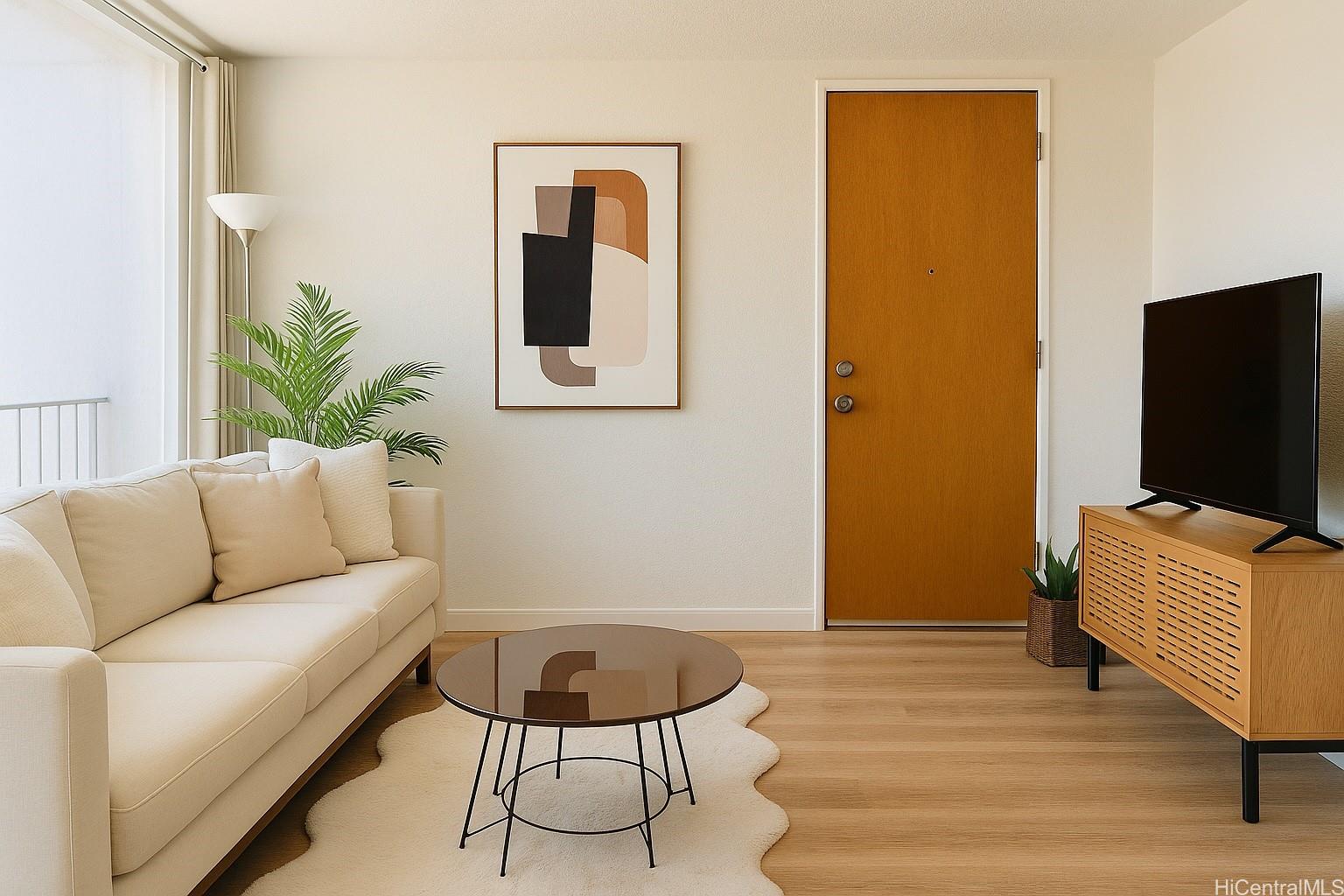 1456 Thurston Avenue, Unit A204 Honolulu, HI 96822 - Photo 2 of 12 a living room with furniture and a flat screen tv