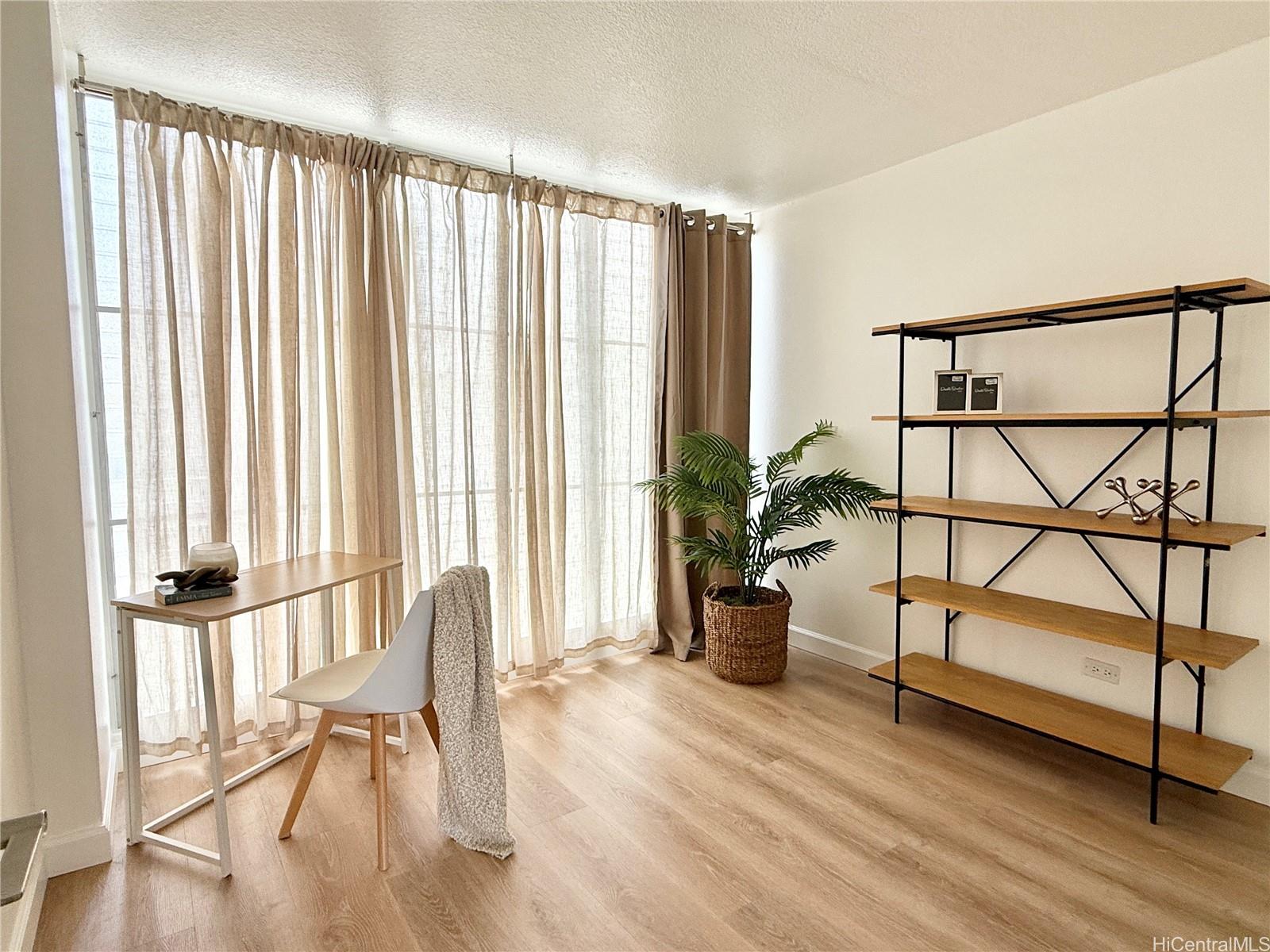 1456 Thurston Avenue, Unit A204 Honolulu, HI 96822 - Photo 8 of 12 a view of entryway with wooden floor and windows