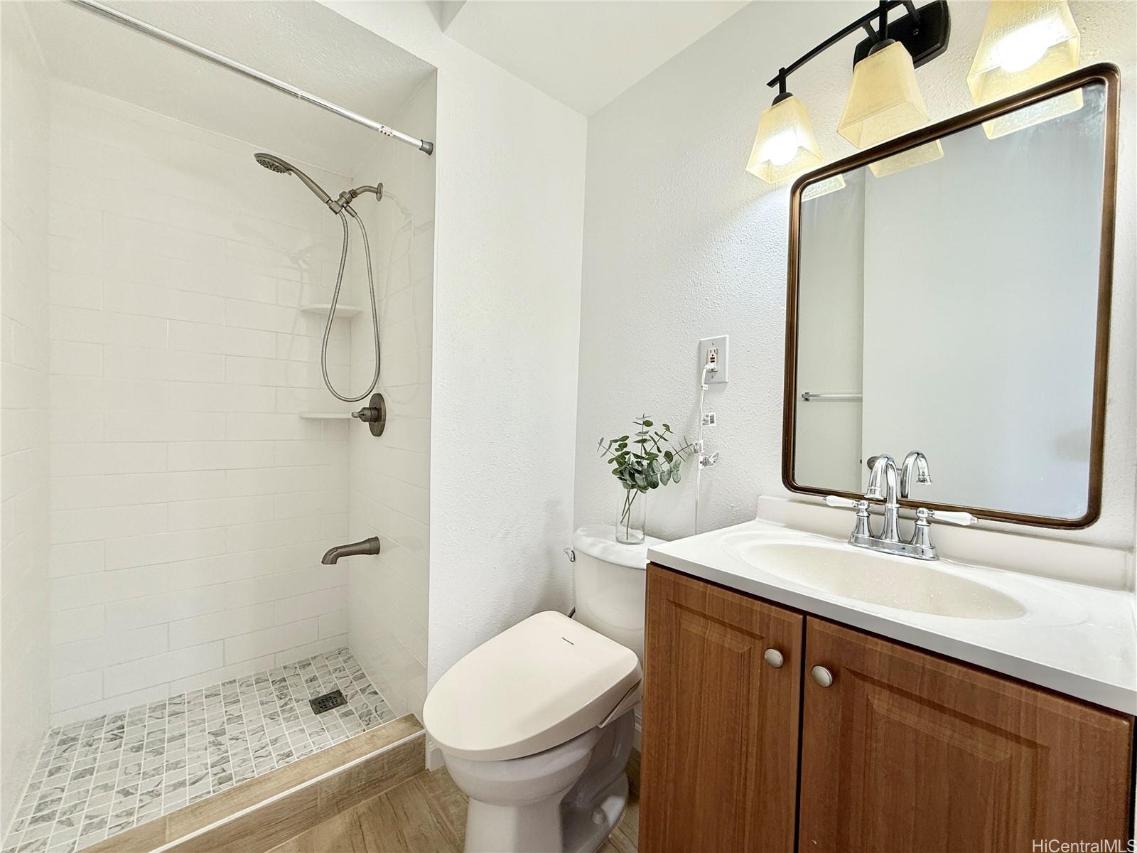 1456 Thurston Avenue, Unit A204 Honolulu, HI 96822 - Photo 9 of 12 a bathroom with a sink toilet and shower