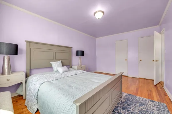 a bedroom with a bed and a walk in closet