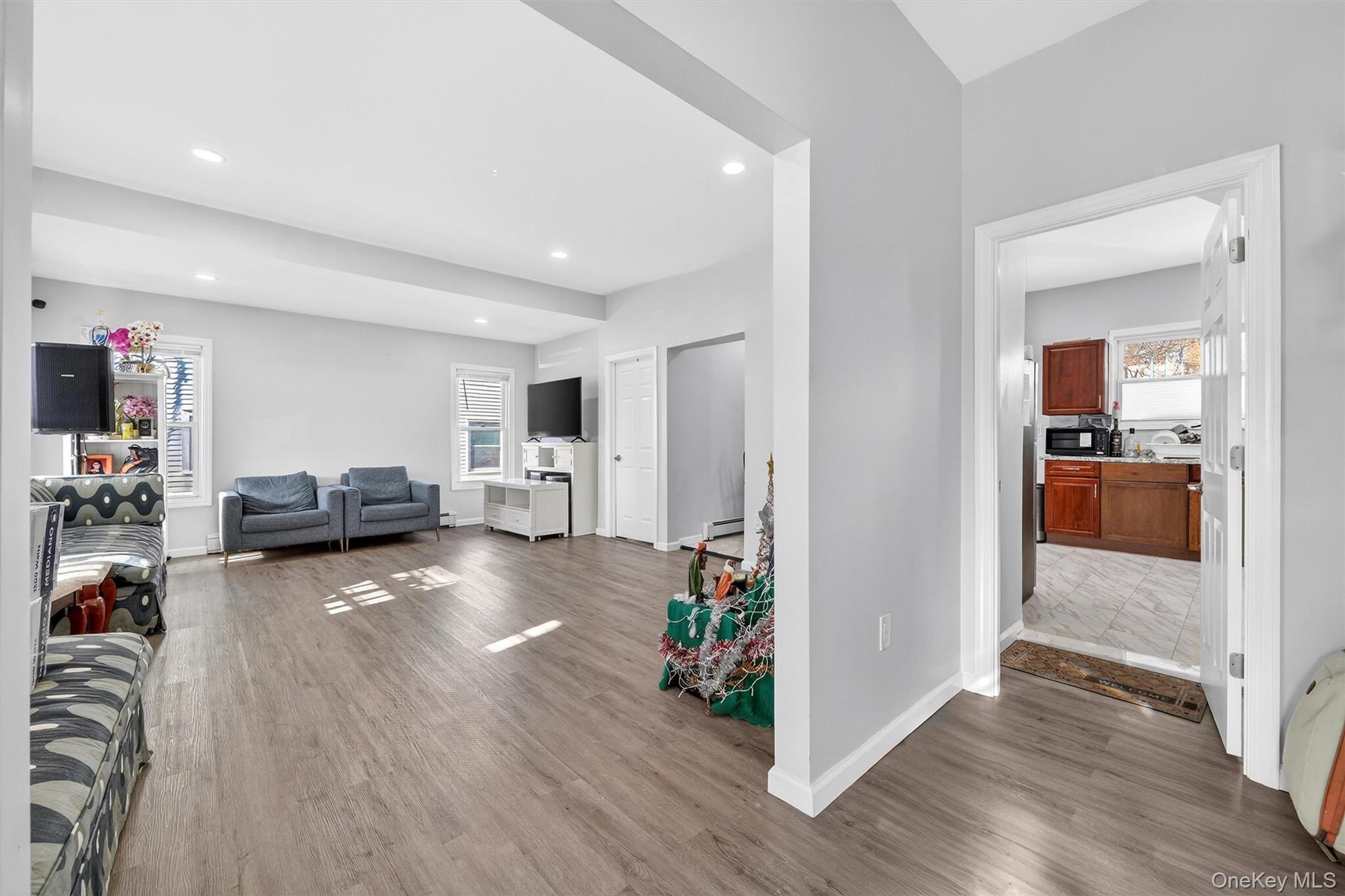 1106 Orchard Street Peekskill, NY 10566 - Photo 6 of 32 Living area featuring dark wood-style flooring and recessed lighting