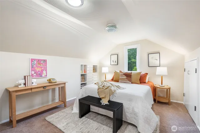 a bed room with a bed and a couch