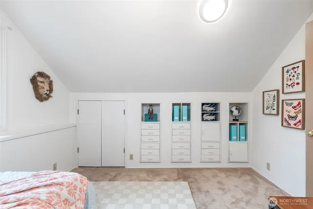 a bedroom with a bed and a couch