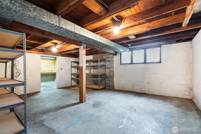 a view of a room with wooden roof and windows