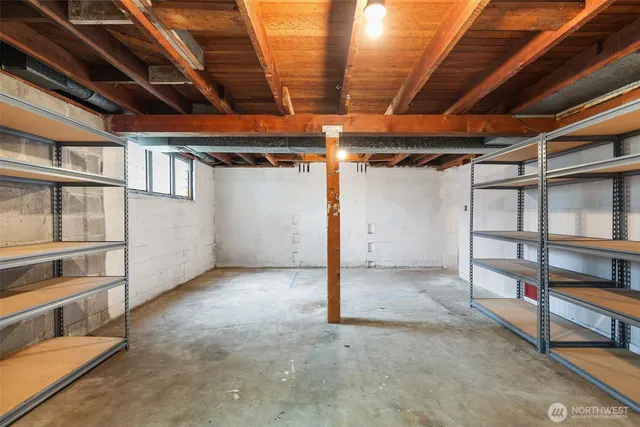 a view of an empty room with storage