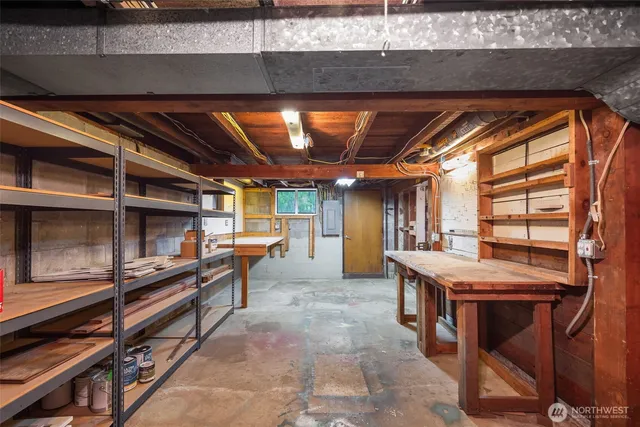 a dining room with a wooden table and chairs