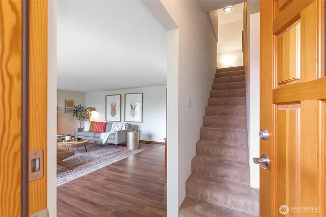 a view of a living room and dining room