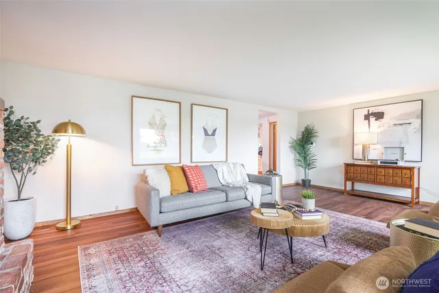 a living room with furniture and a rug
