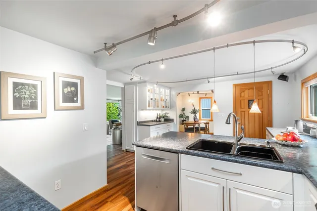 a kitchen with sink cabinets and outdoor view