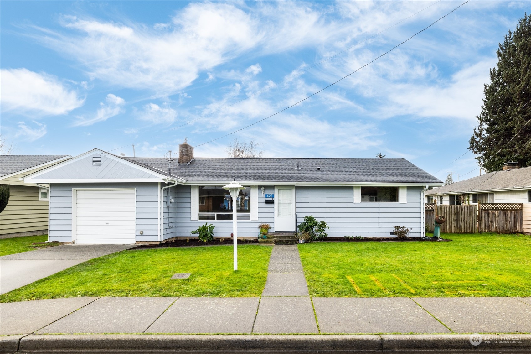 422 Simons Avenue Burlington, WA 98233 - Photo 1 of 21 a front view of a house with a garden and trees