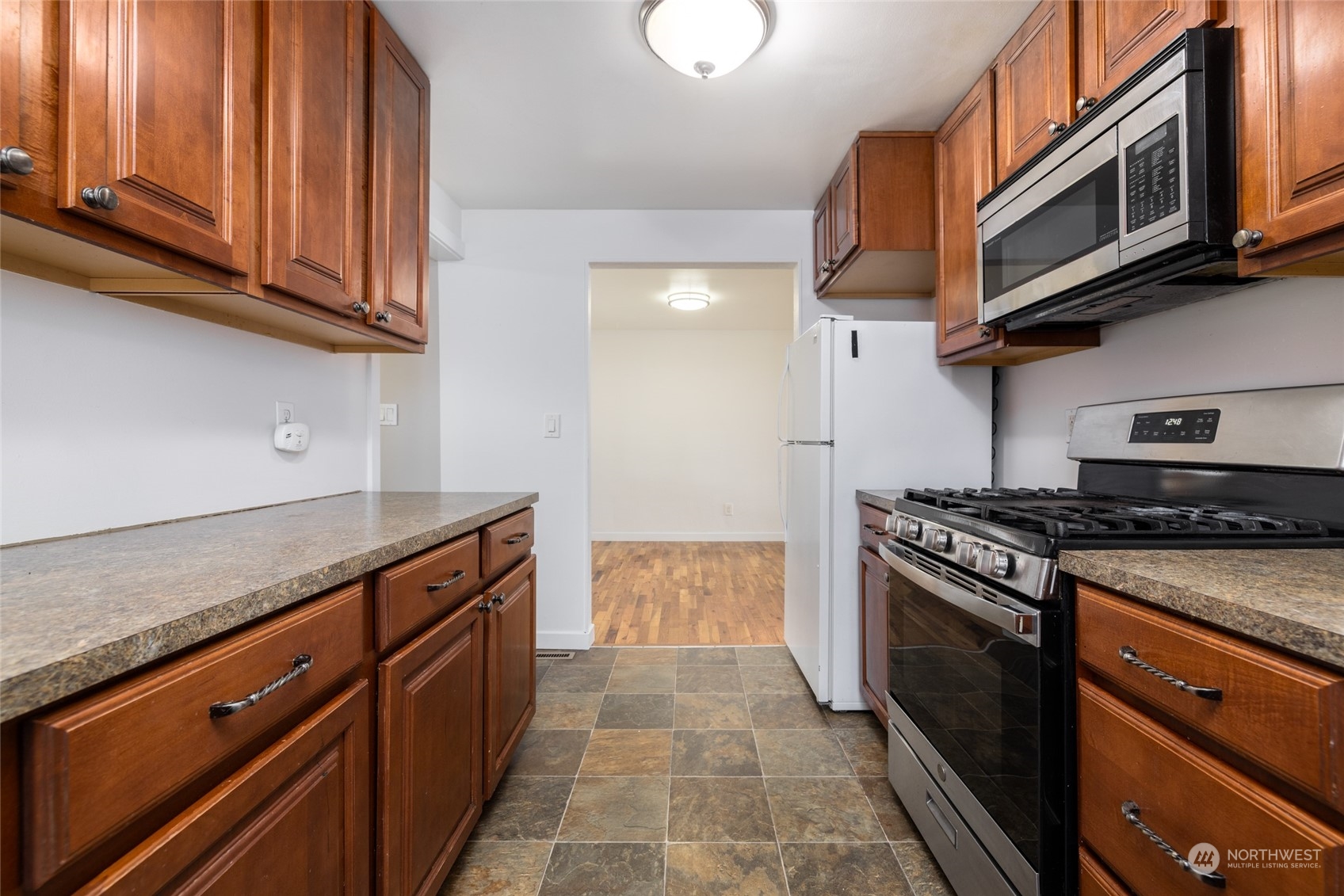 422 Simons Avenue Burlington, WA 98233 - Photo 11 of 21 a kitchen with stainless steel appliances granite countertop a stove and a microwave