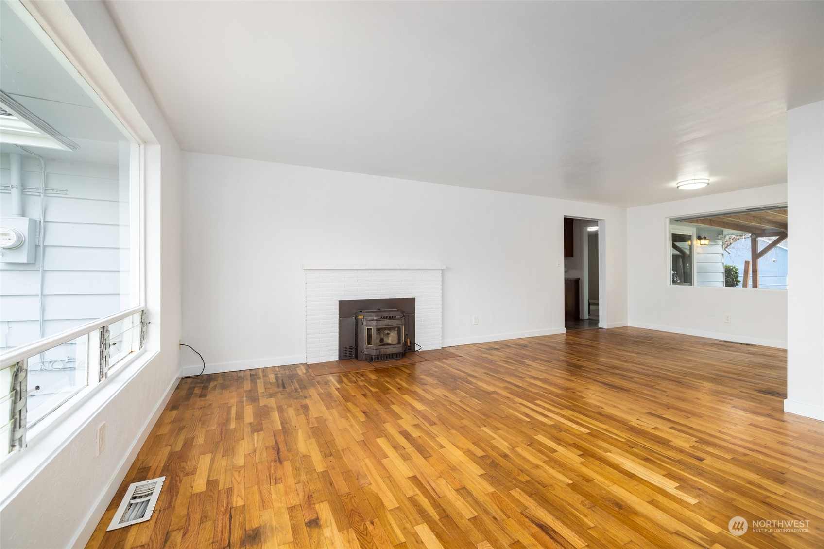 422 Simons Avenue Burlington, WA 98233 - Photo 4 of 21 a view of an empty room with window and wooden floor