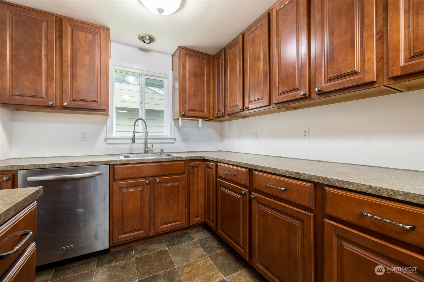 422 Simons Avenue Burlington, WA 98233 - Photo 9 of 21 a kitchen with stainless steel appliances granite countertop wooden cabinets a sink and dishwasher