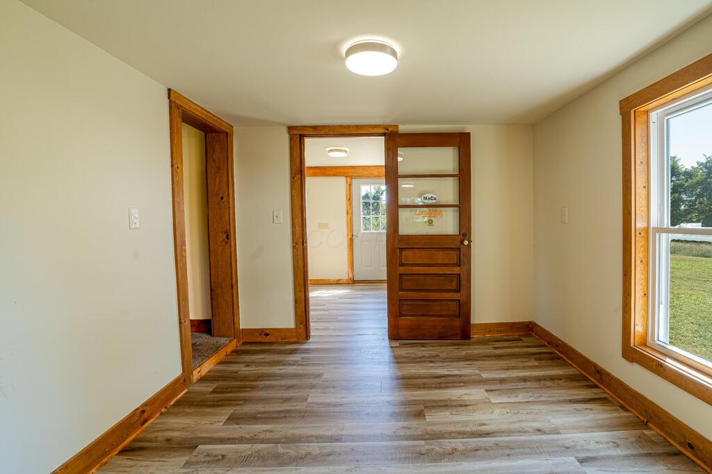 681 Downing Road Stockport, OH 43787 - Photo 24 of 36 Hallway Wood Floor Door and Window View