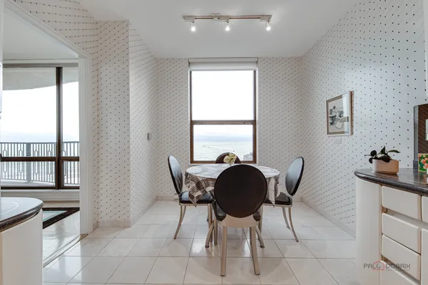 a view of a dining room with furniture and a window