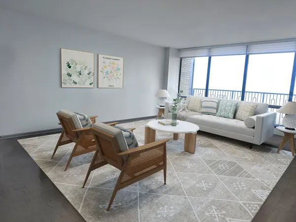 a living room with furniture and a large window