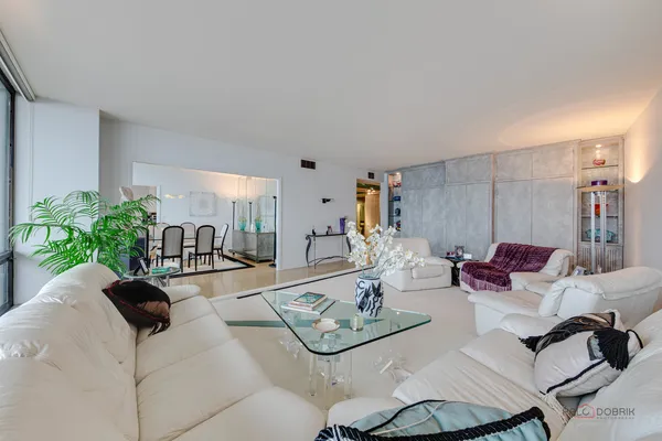a living room with furniture and a table