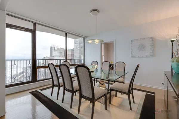 a view of a dining room with furniture window and outside view