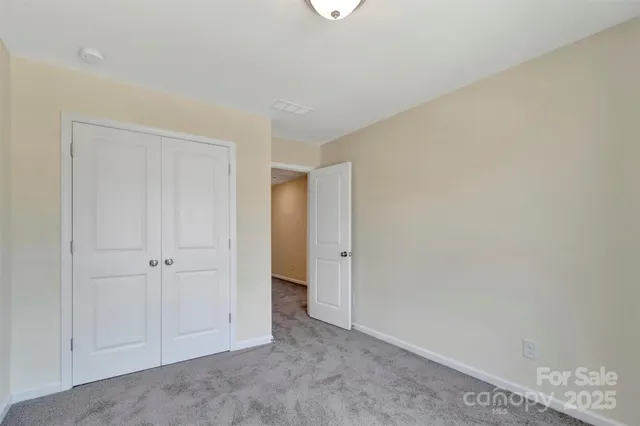 a bathroom with a granite countertop sink toilet vanity and bathtub