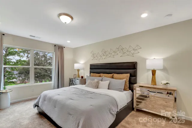 a bed room with a bed and a dresser