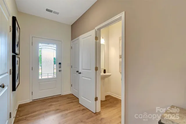 a view of livingroom with hardwood floor and closet