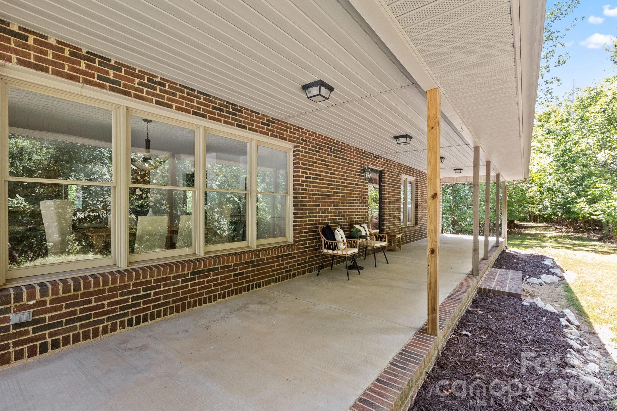 3090 Goblet Road Richburg, SC 29729 - Photo 11 of 48 a view of a chairs with porch in the backyard
