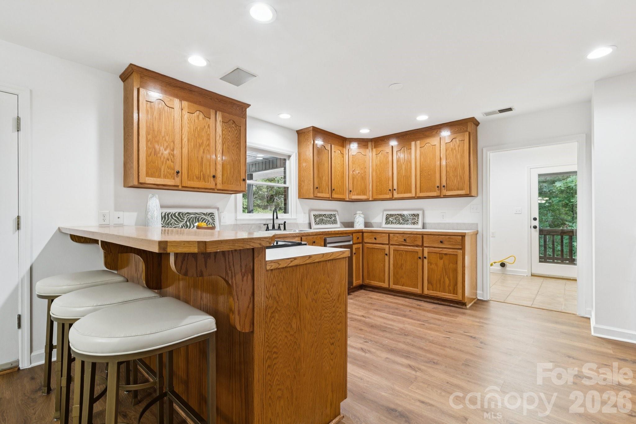 3090 Goblet Road Richburg, SC 29729 - Photo 14 of 48 a kitchen with a table chairs sink and cabinets