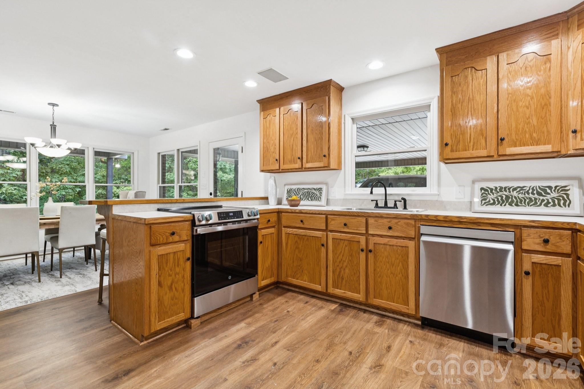 3090 Goblet Road Richburg, SC 29729 - Photo 17 of 48 a kitchen with a sink cabinets and wooden floor