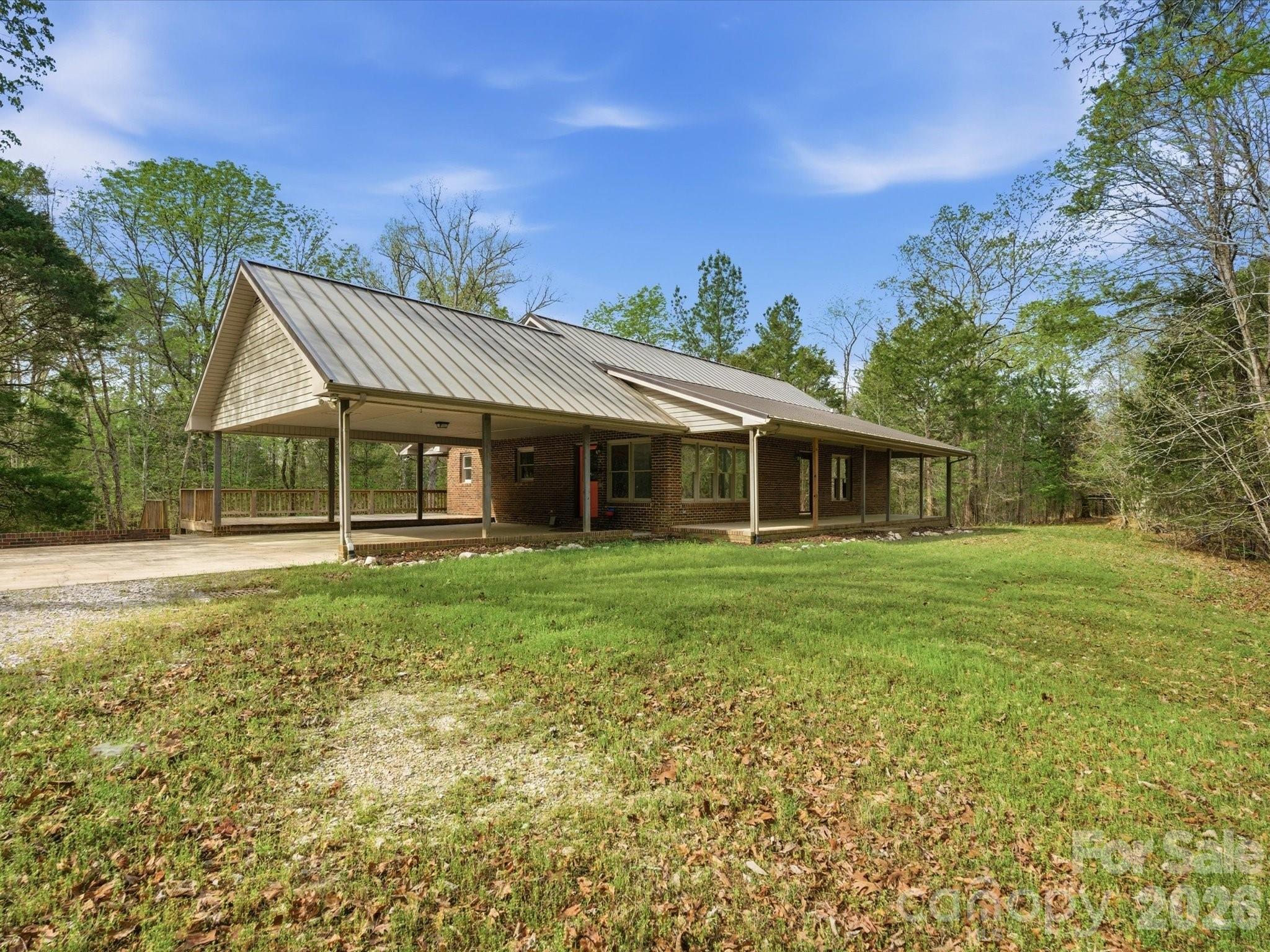 3090 Goblet Road Richburg, SC 29729 - Photo 2 of 48 a front view of a house with a garden